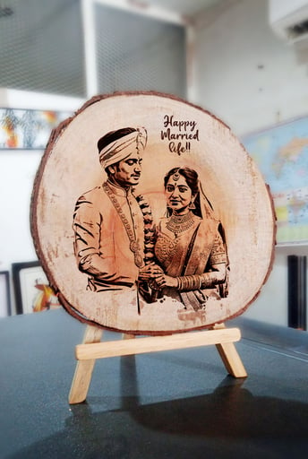 a wooden slice with a couple on it